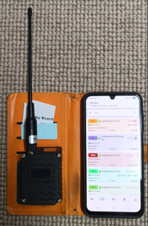 Meshtastic unit with mobile phone showing app